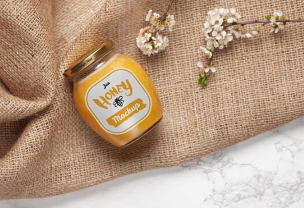 Beekeeper handling a frame in the apiary